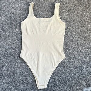 Elegant Cream Ribbed Shapewear Bodysuit